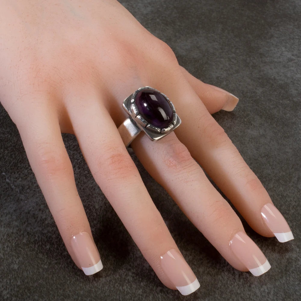 Joe O'Neil Navajo Sugilite sterling silver ring worn on hand
