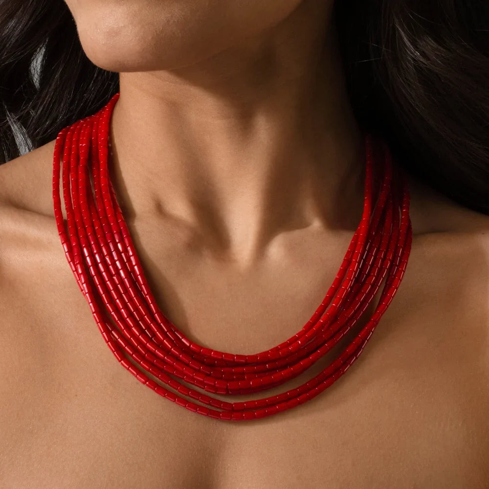 red coral multi-strand necklace worn on model