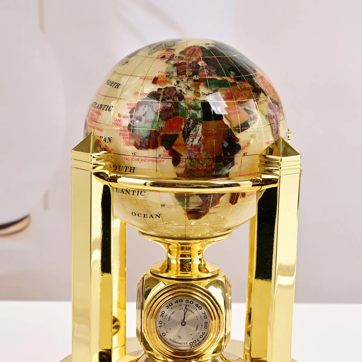 8.5" Tall Gemstone Globe with 4" Mother of Pearl Diamond Cut Ocean on 24k Gold Plated Bi-directional rotating Stand