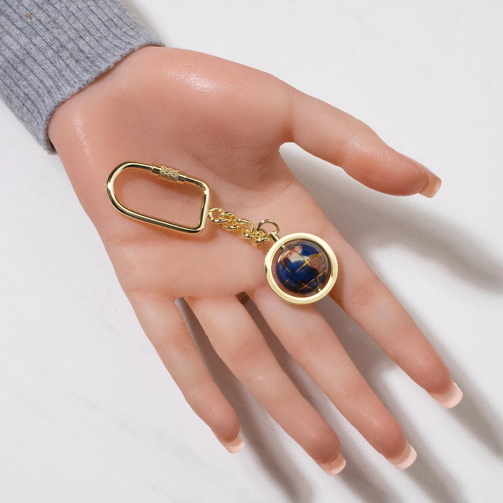Gemstone Globe with Lapis Ocean showcased on a Gold Colored Keychain
