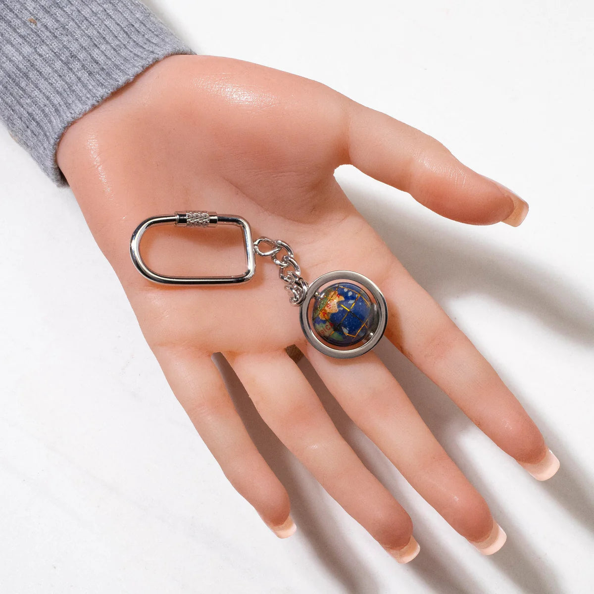 Gemstone Globe with Lapis Ocean showcased on a Silver Colored Keychain