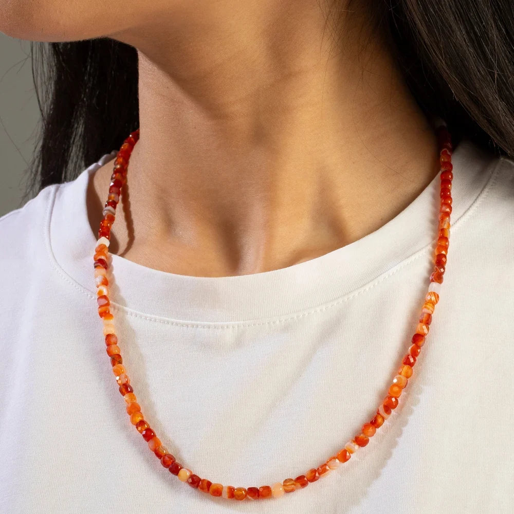 carnelian faceted cube necklace worn on model