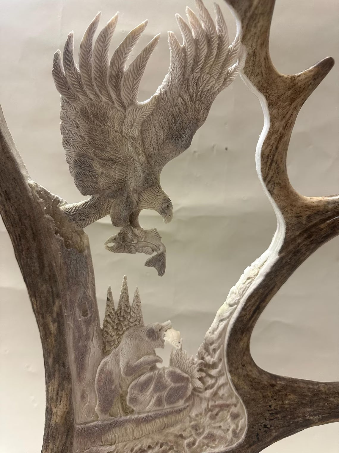 Last Catch close detail showing eagle bear and fish carving
