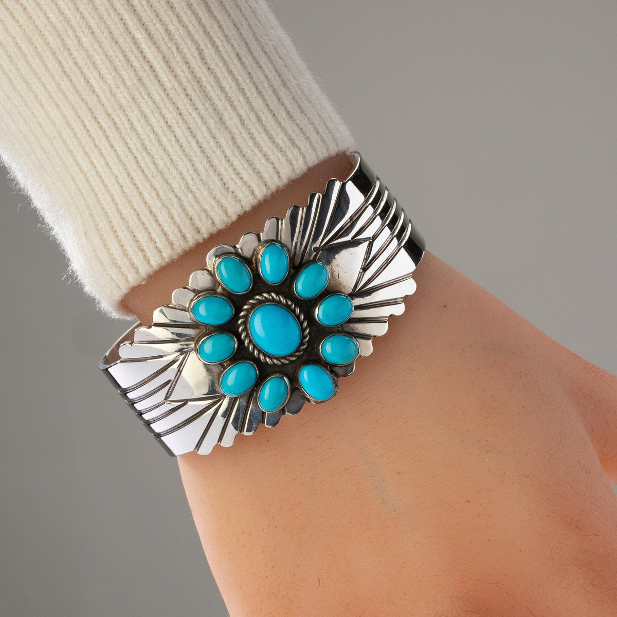 Richard Long Sr. Sleeping Beauty turquoise flower cuff worn on wrist